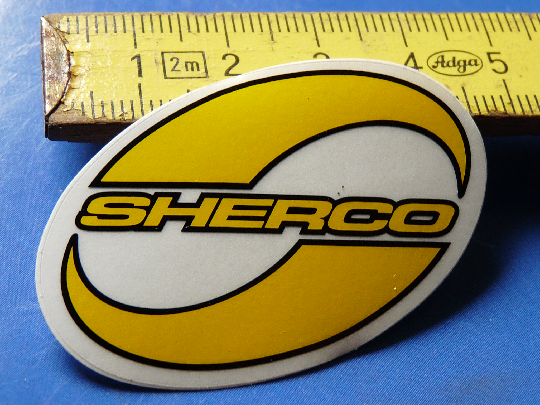 Sherco Aufkleber 4 cm gelb